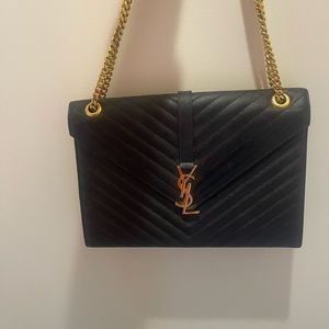 Saint Laurent - Large Matelasse Chevron Leather shoulder bag in black w/ gold